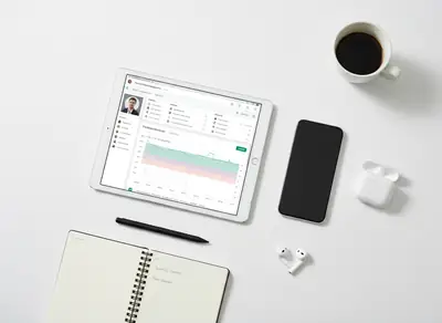 Desk with a computer, a mobile phone and a notebook
